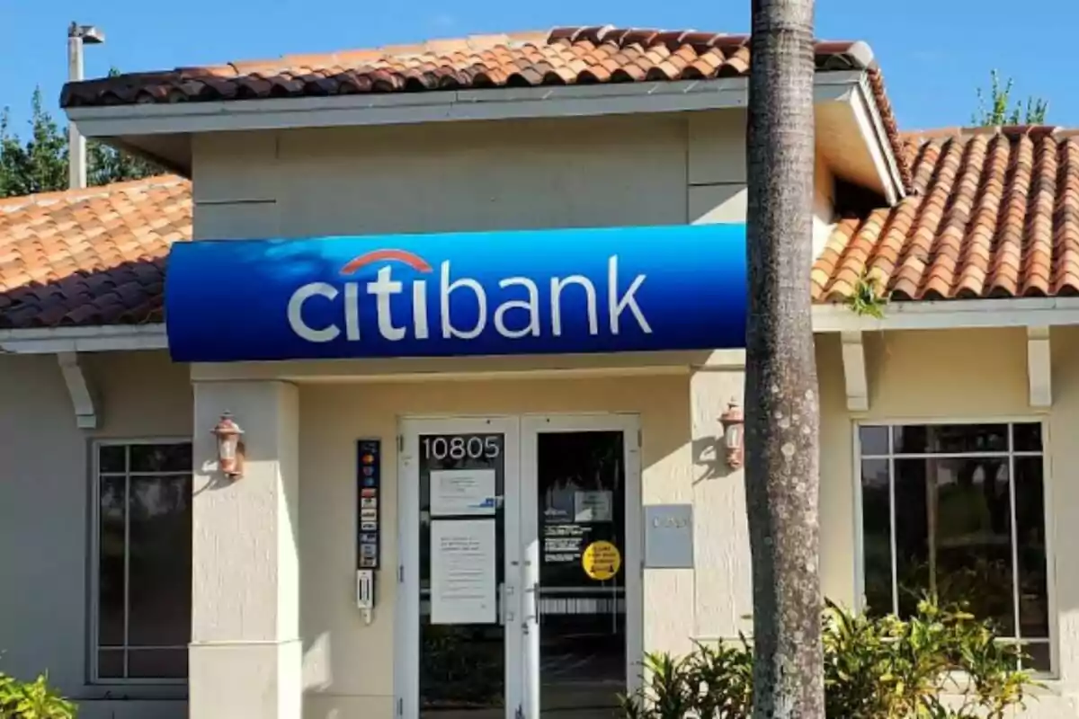 Citibank branch with a tiled roof and a blue sign at the entrance. Citibank branch with a tiled roof and a blue sign at the entrance.