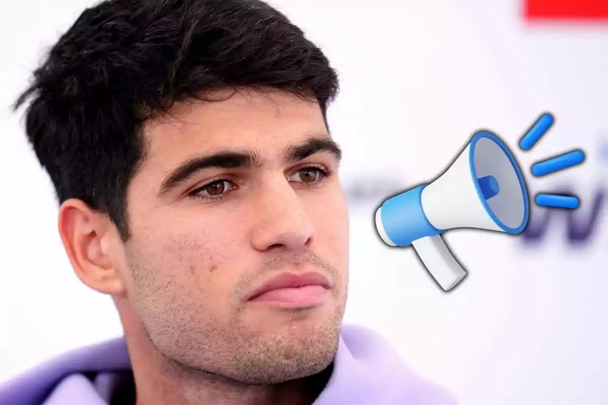 Young dark-haired person with a serious expression and a blue and white megaphone drawn next to their face