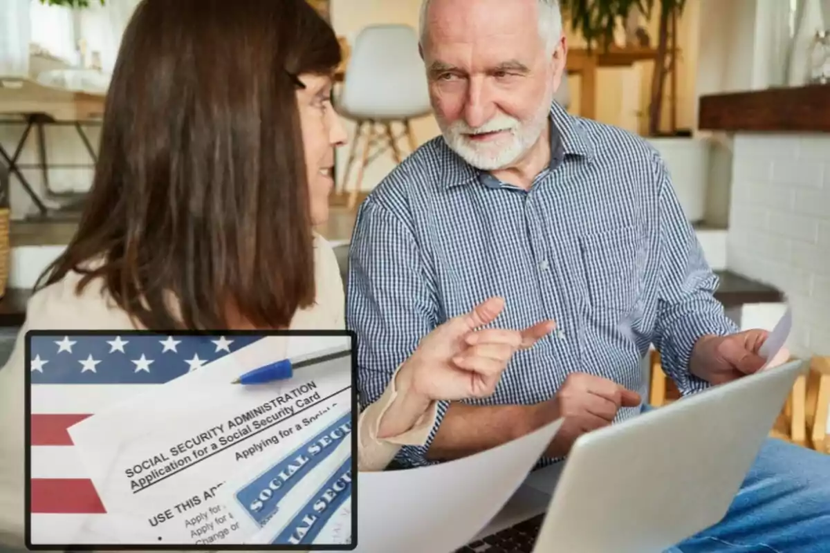 Elderly couple talking in front of a laptop with United States Social Security documents in the foreground