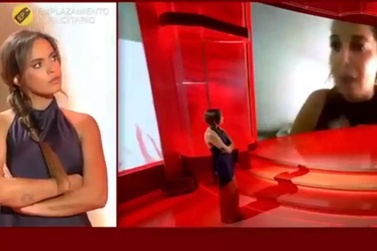 Dona de cabell llarg amb una trena i vestit fosc apareix dues vegades en un plató de televisió vermell, una en primer pla i una altra d’esquena mirant una pantalla gegant on es projecta el rostre d’una altra persona. Dona de cabell llarg amb una trena i vestit fosc apareix dues vegades en un plató de televisió vermell, una en primer pla i una altra d’esquena mirant una pantalla gegant on es projecta el rostre d’una altra persona.