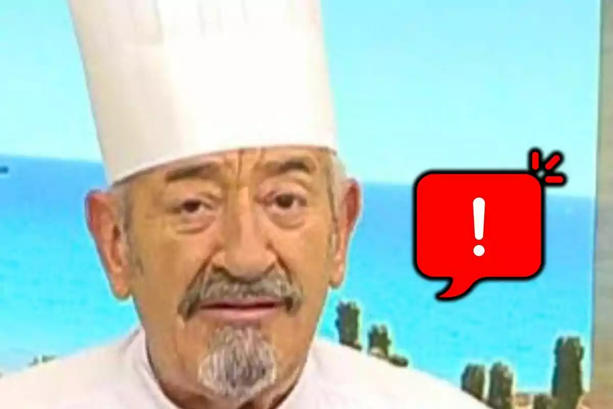 Xef d’edat avançada amb barret blanc, que és Karlos Arguiñano, i expressió seriosa al costat d’una icona d’advertència en un fons de platja.