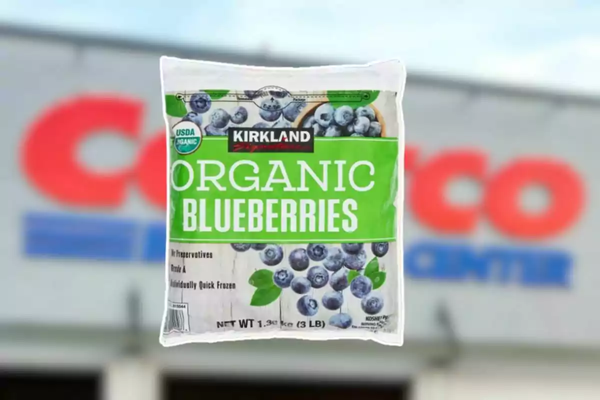 Bag of Kirkland Signature organic blueberries in front of a blurred Costco store