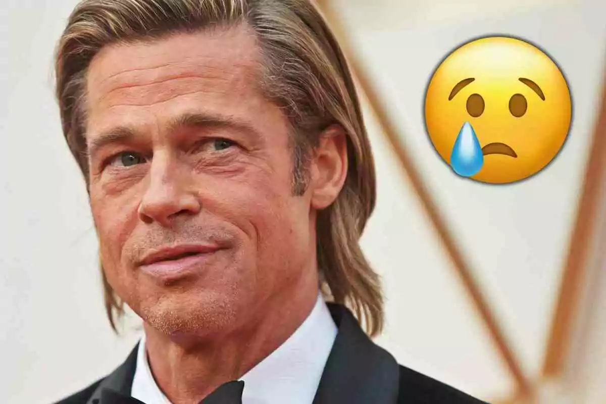 Brad Pitt de cabello rubio con expresión seria y un emoji de carita triste con lágrima a su lado
