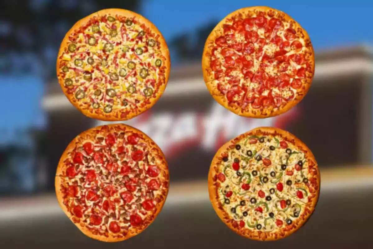 Cuatro pizzas diferentes con diversos ingredientes sobre un fondo desenfocado Cuatro pizzas diferentes con diversos ingredientes sobre un fondo desenfocado