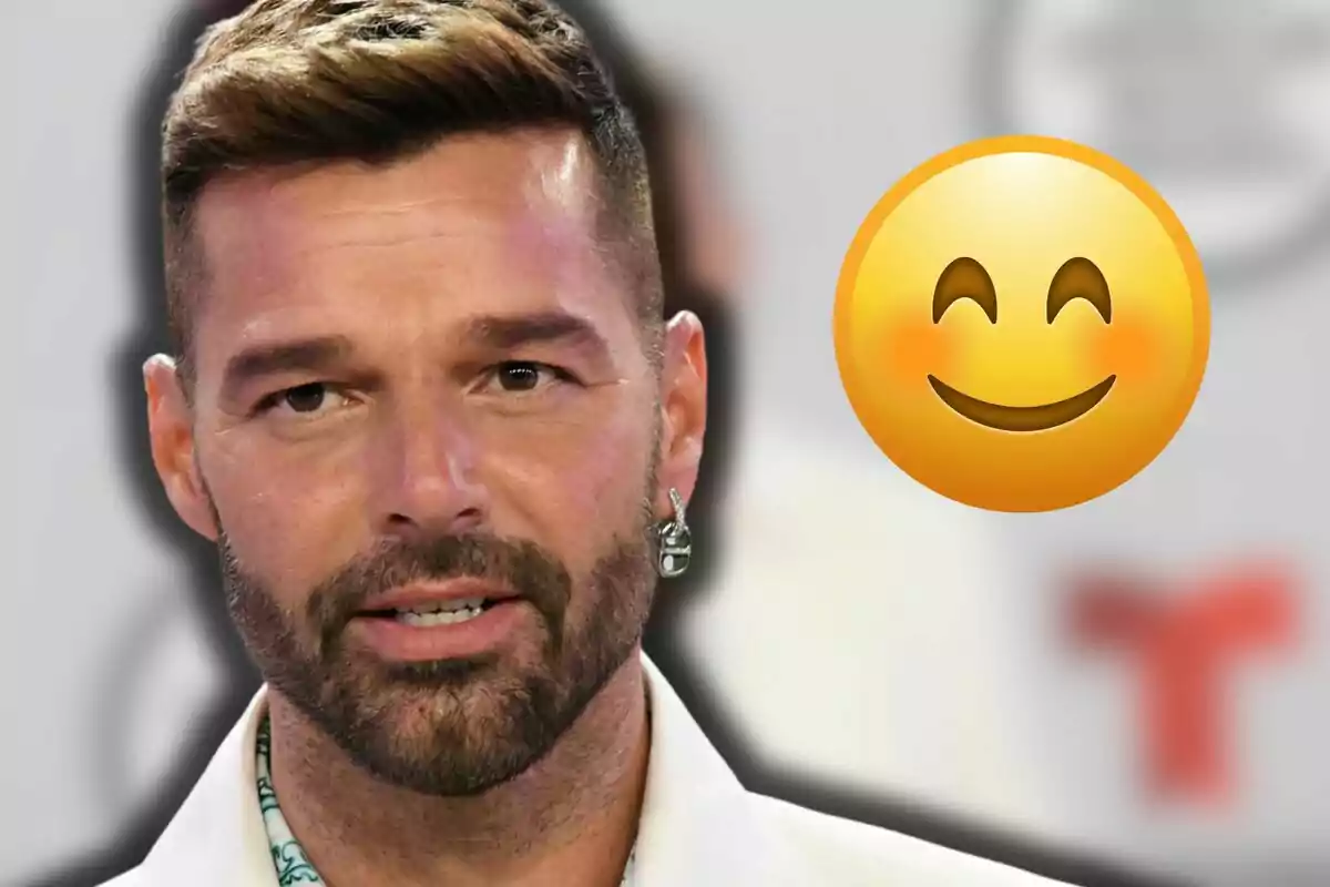 Ricky Martin dressed in white next to a smiling emoji with blushing cheeks