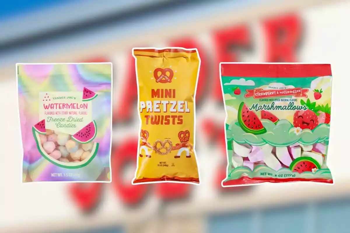 Three bags of Trader Joe’s snacks—one of freeze-dried watermelon-flavored candy, another of mini pretzels, and one more of strawberry and watermelon-flavored marshmallows—on a blurred background.