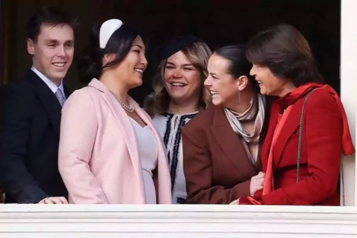 Louis Ducruet, his wife, Camille Gottlieb, Pauline Ducruet, and Princess Stéphanie of Monaco, elegantly dressed, smile and chat as they look out from a balcony. Louis Ducruet, his wife, Camille Gottlieb, Pauline Ducruet, and Princess Stéphanie of Monaco, elegantly dressed, smile and chat as they look out from a balcony.
