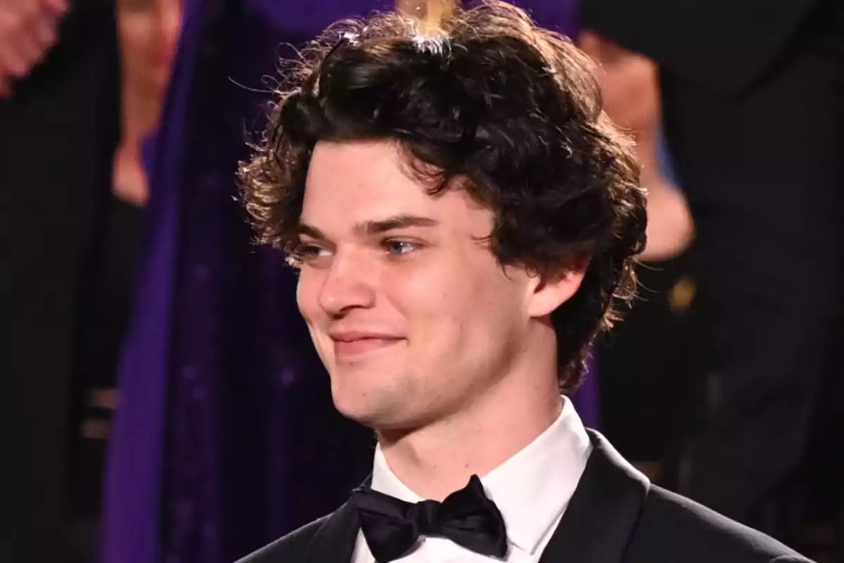 Homer Gere wearing a tuxedo and a black bow tie at a formal event Homer Gere wearing a tuxedo and a black bow tie at a formal event
