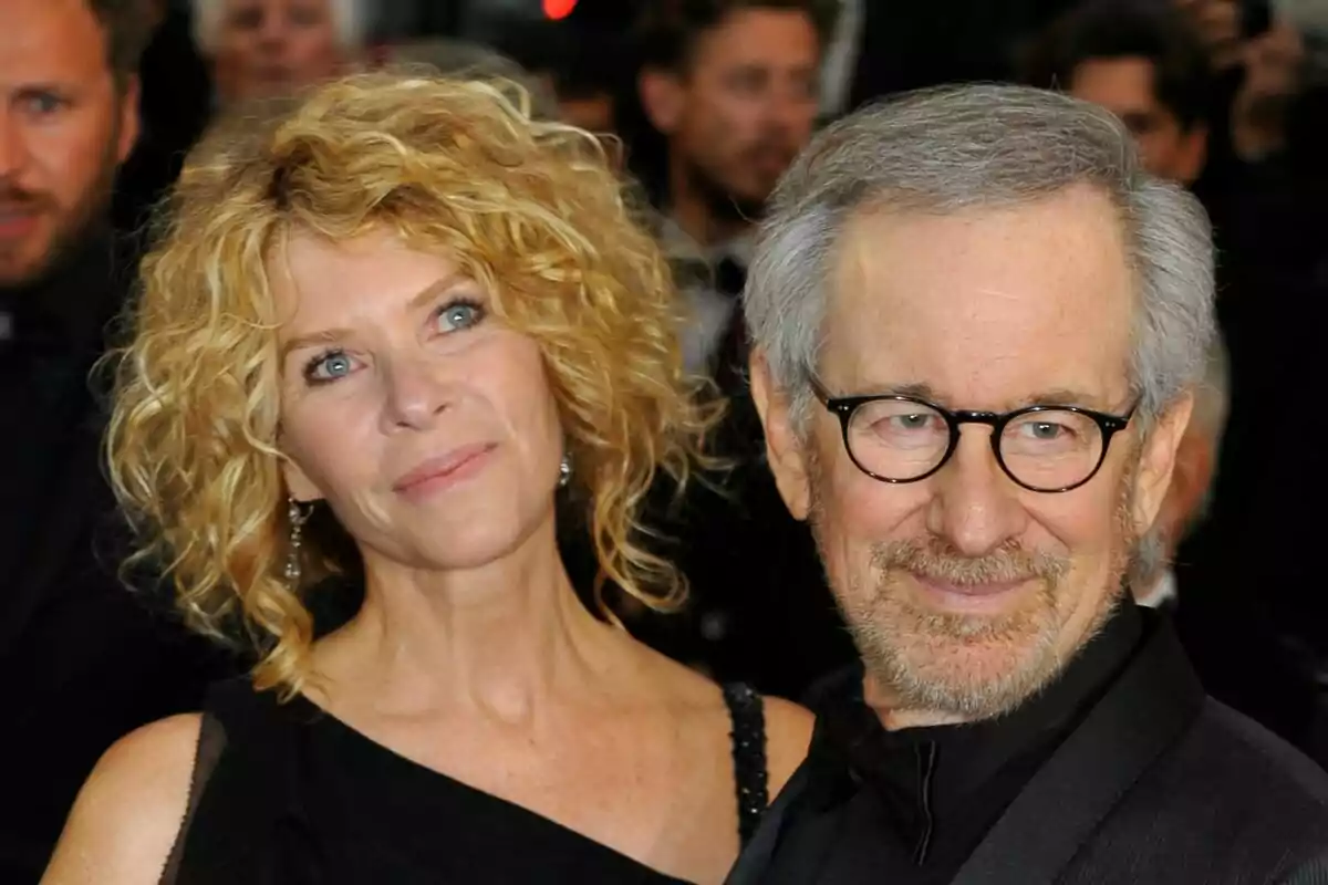 Elegantly dressed couple—Kate Capshaw and Steven Spielberg—posing at a formal event. Elegantly dressed couple—Kate Capshaw and Steven Spielberg—posing at a formal event.