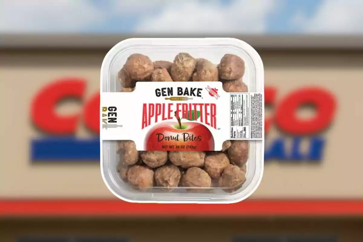 Small apple fritter flavored donut container from the Gen Bake brand in front of a blurred Costco store. Small apple fritter flavored donut container from the Gen Bake brand in front of a blurred Costco store.