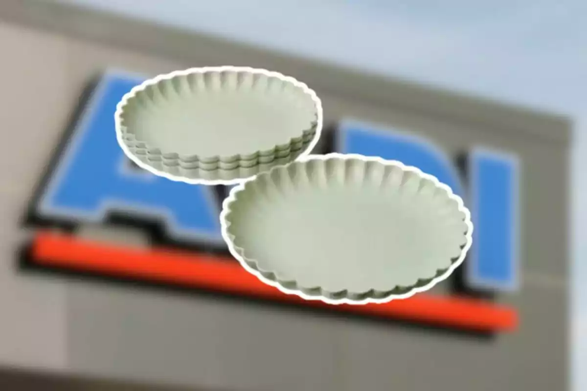 Two round pie pans with fluted edges on a blurred background of an Aldi store Two round pie pans with fluted edges on a blurred background of an Aldi store