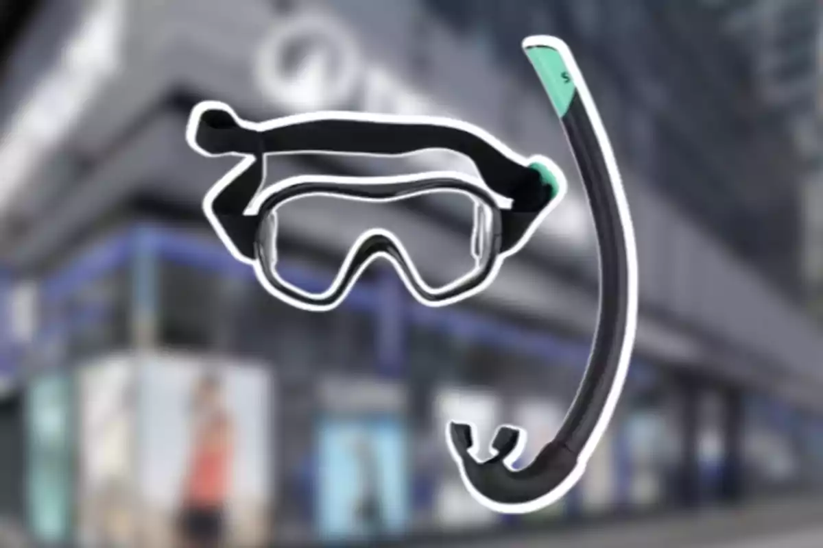Un visor i un tub de busseig amb un edifici desenfocat de fons Un visor i un tub de busseig amb un edifici desenfocat de fons