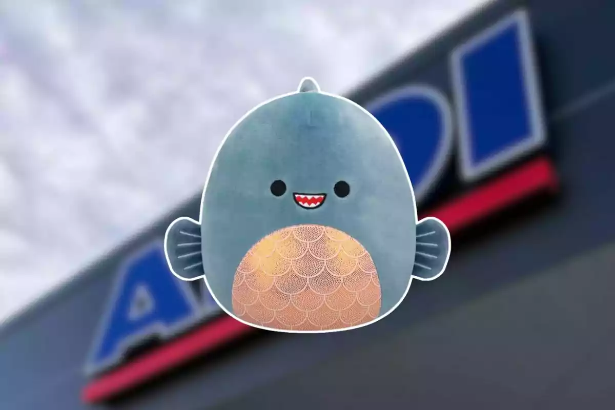 Smiling shark plush with a blurry store sign background. Smiling shark plush with a blurry store sign background.