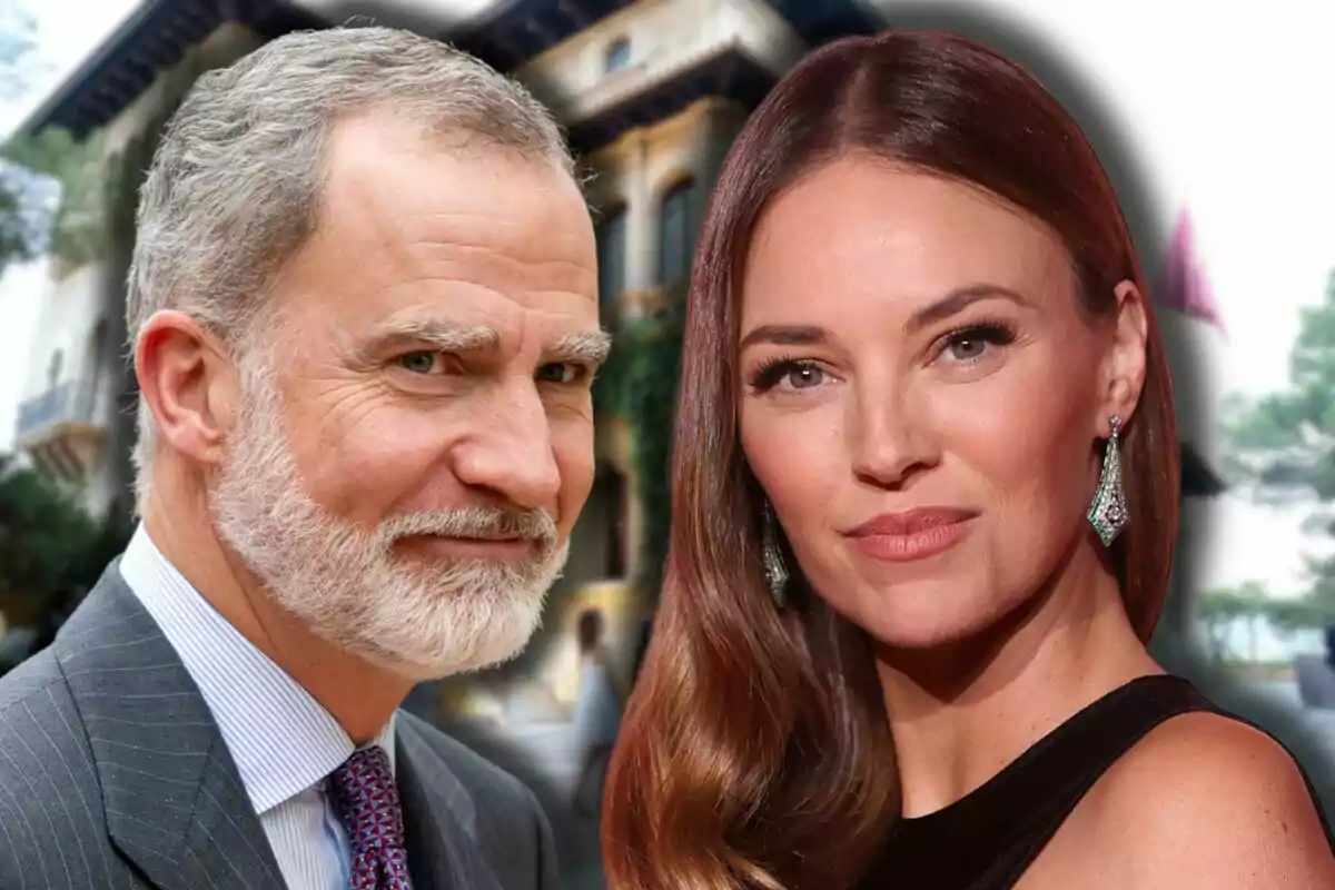 Felipe VI con traje y Helen Lindes con vestido negro y aretes verdes posan juntos frente a un edificio elegante desenfocado.