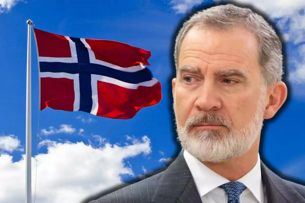Felipe VI with a serious expression in the foreground and a Norwegian flag waving against a blue sky with clouds in the background