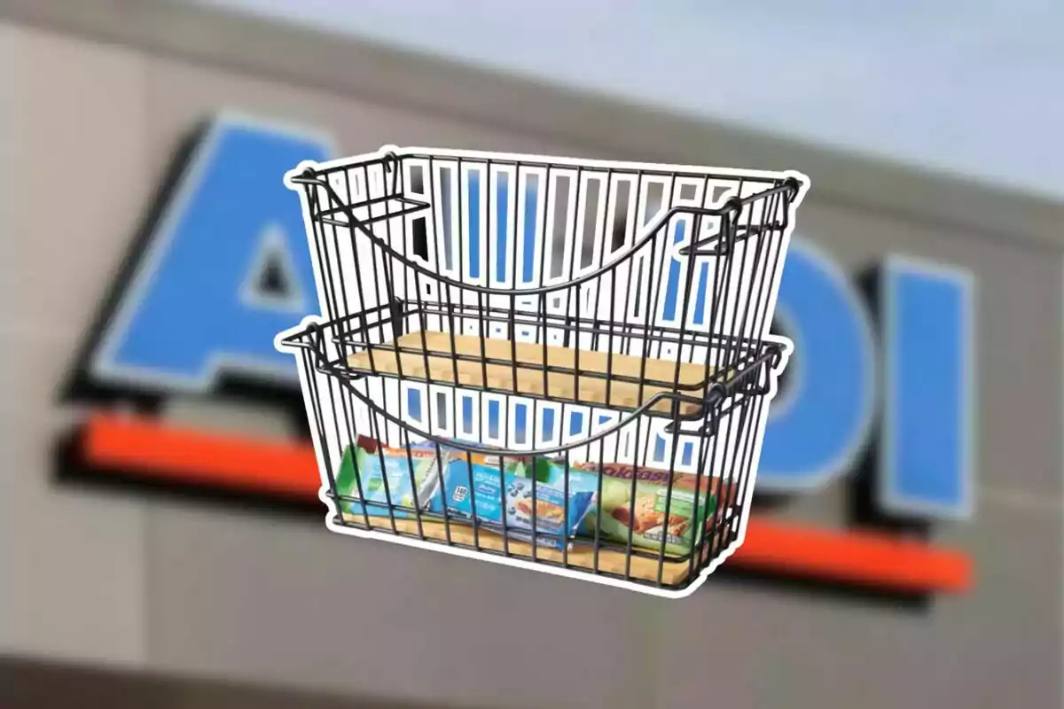 Two-tier metal basket with products inside against a blurred background of a supermarket sign