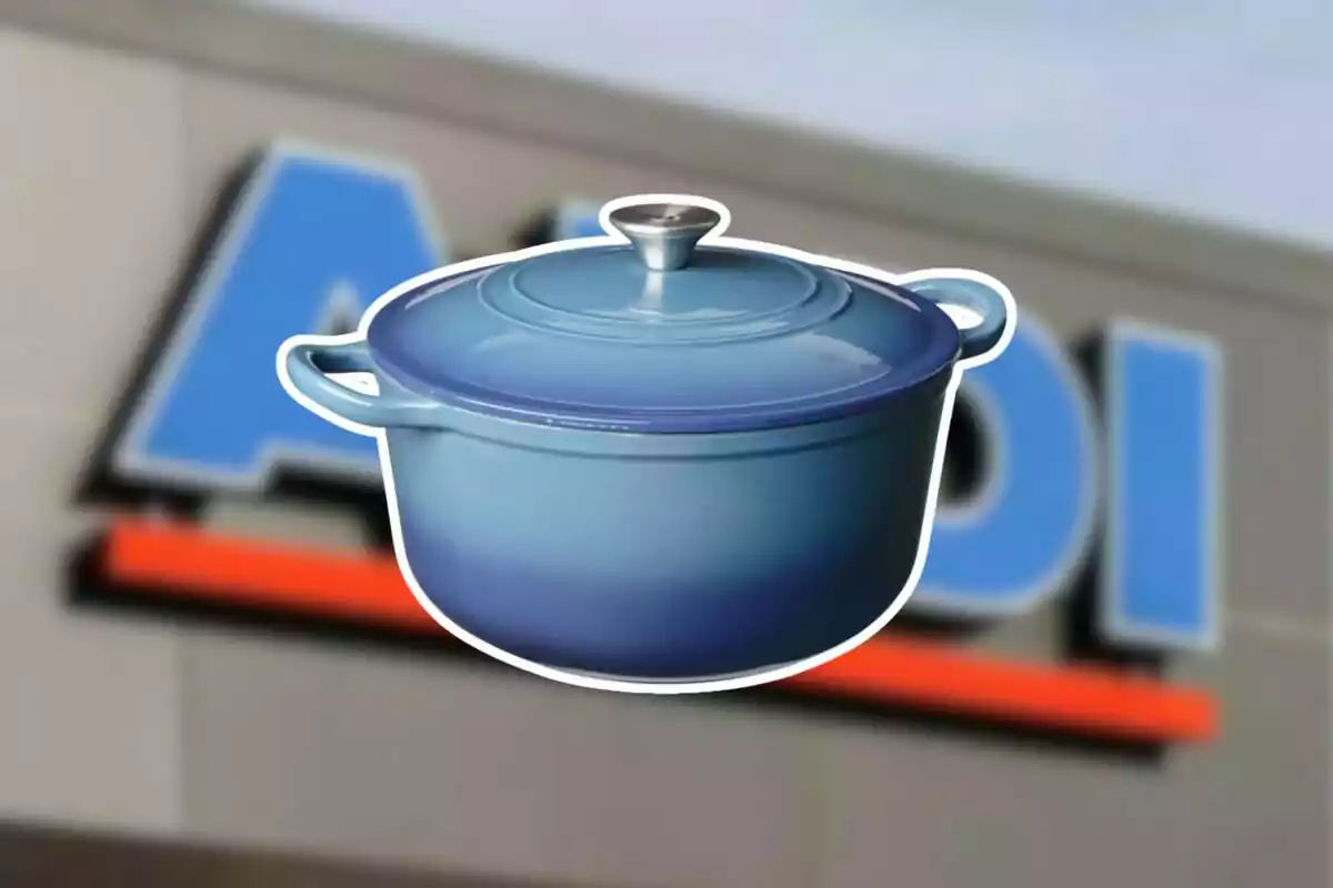 Blue cast iron pot in front of a blurry store sign Blue cast iron pot in front of a blurry store sign