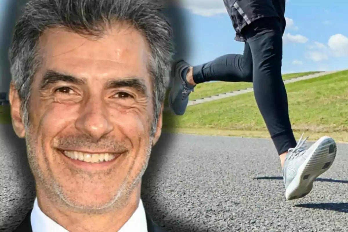 Jorge Fernández somrient en primer pla al costat d’una persona corrent a l’aire lliure sobre una pista asfaltada.