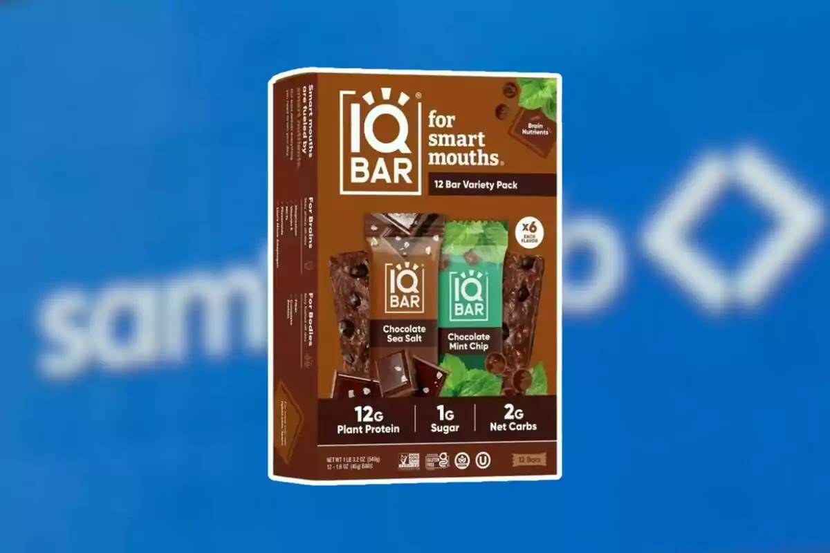 IQ BAR protein bar variety box chocolate on a blurred blue background