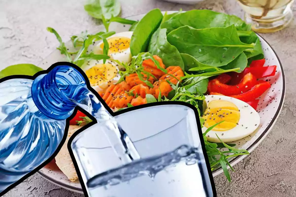Bottle of water refilling a glass, cropped close-up on salad background. Bottle of water refilling a glass, cropped close-up on salad background.