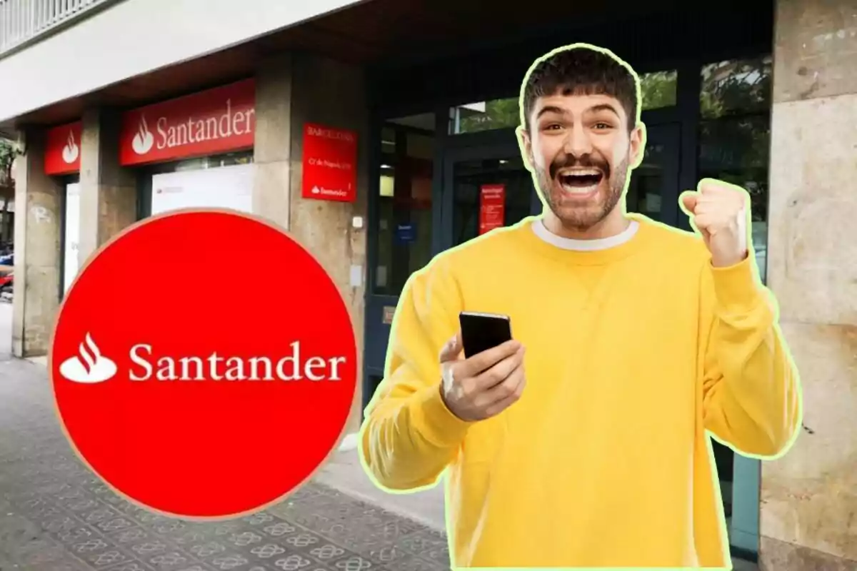 Un home somrient amb un telèfon mòbil a la mà davant d'una sucursal del banc Santander.