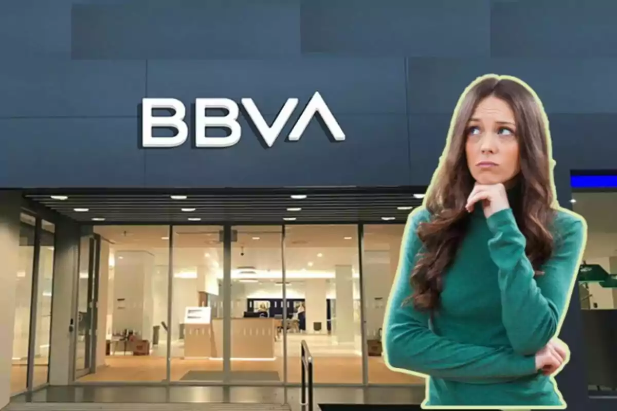 A woman contemplating in front of a BBVA bank branch.