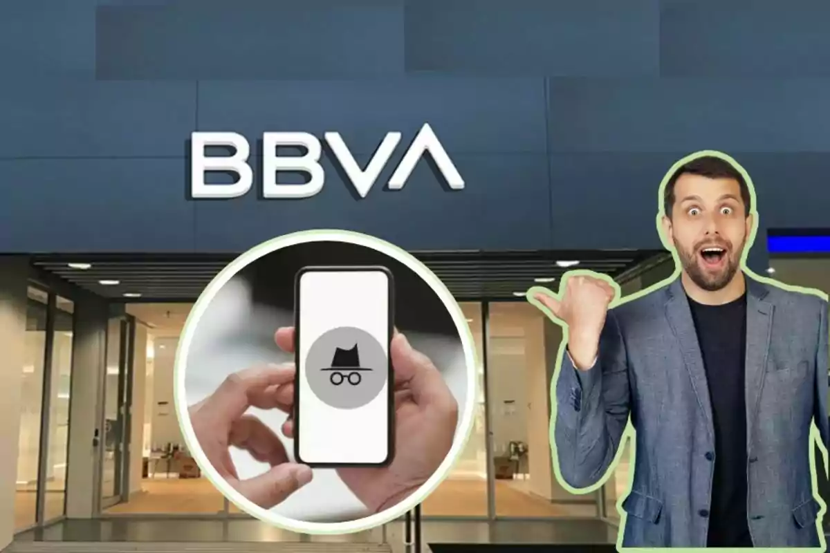 Un home sorprès assenyala un telèfon amb una icona d'incògnit davant d'una sucursal de BBVA.