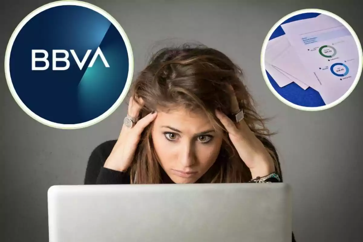 Dona preocupada davant dun ordinador amb el logo de BBVA i documents financers.