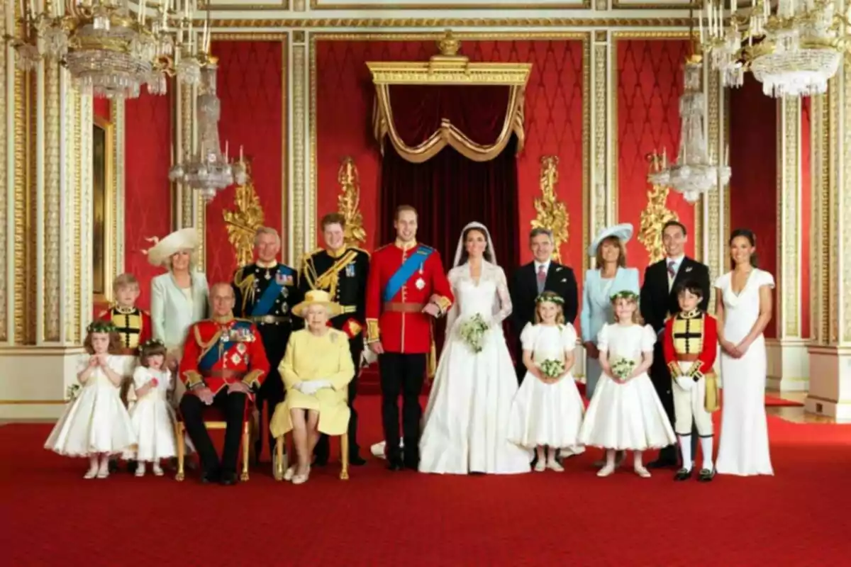 A group of elegantly dressed people posing in a room decorated with red walls and golden details. A group of elegantly dressed people posing in a room decorated with red walls and golden details.
