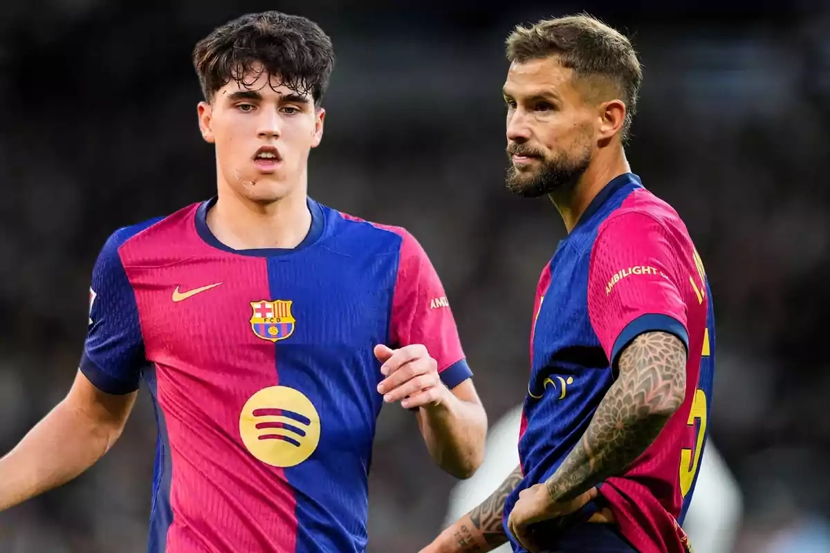 Two soccer players wearing FC Barcelona uniforms on the field. Two soccer players wearing FC Barcelona uniforms on the field.