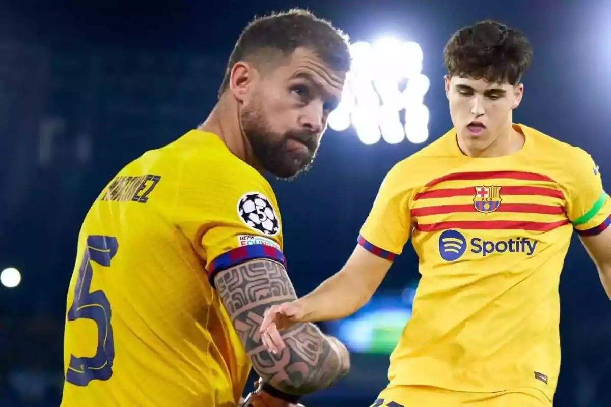 Two football players in yellow FC Barcelona uniforms during a match.