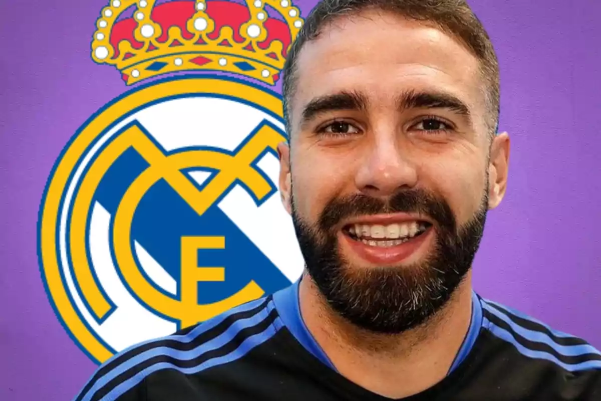 Un home somrient amb barba davant de l'escut del Reial Madrid sobre un fons porpra.