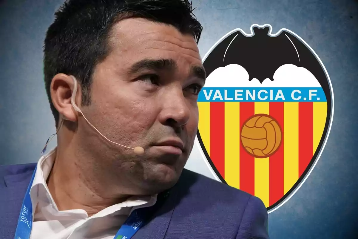 A man with a headset microphone in front of the Valencia C.F. crest.