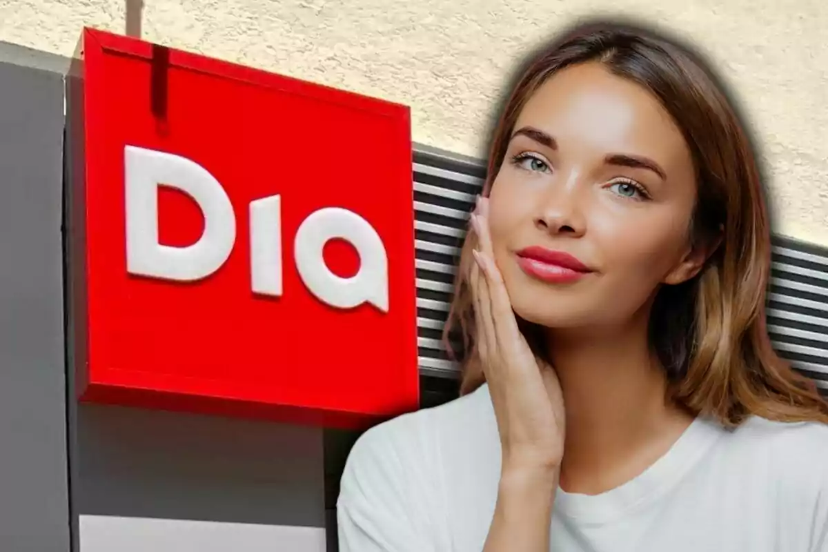 Una dona jove amb cabell castany clar posa tocant-se la cara davant d’un cartell vermell de la botiga Dia