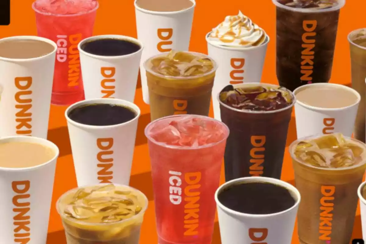 Cups of different hot and cold Dunkin drinks on an orange background Cups of different hot and cold Dunkin drinks on an orange background