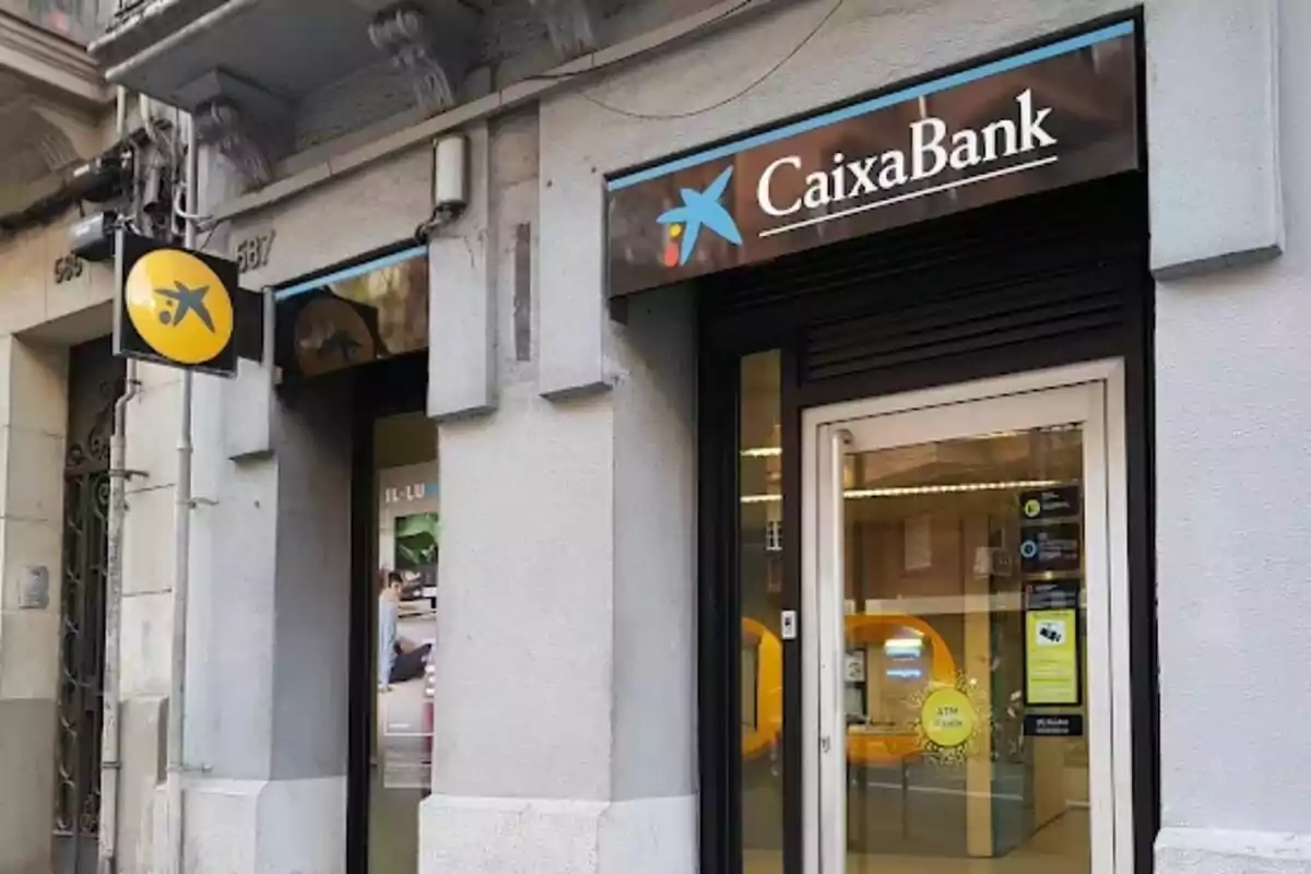 CaixaBank branch facade with logo at the entrance.