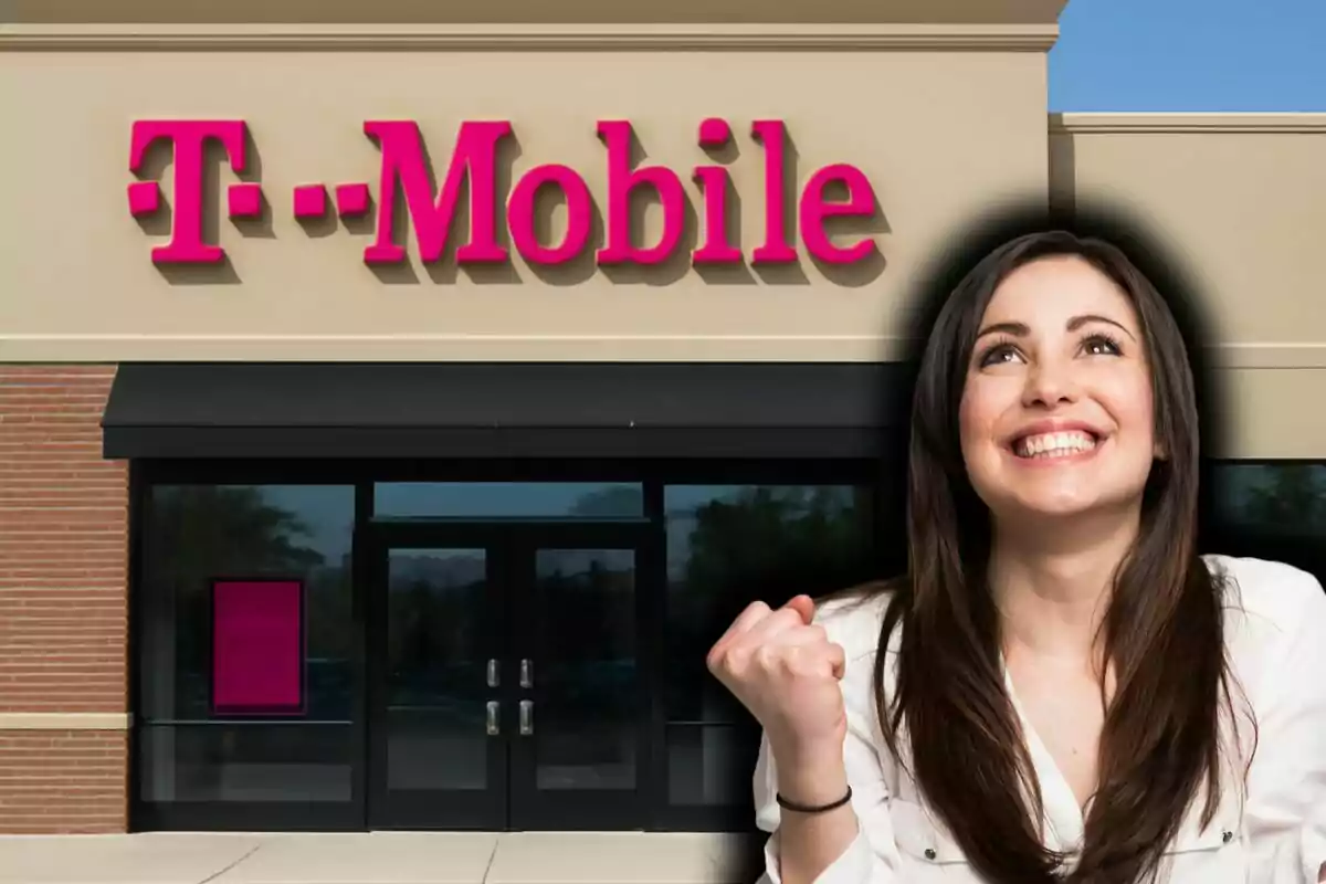 A smiling woman with a triumphant expression in front of a T-Mobile store.