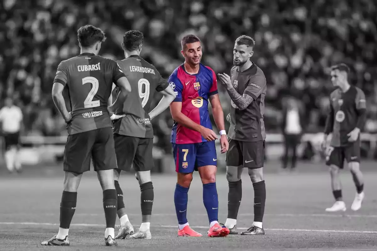 FC Barcelona football players chatting on the field during a match, with the background in black and white and the players in color. FC Barcelona football players chatting on the field during a match, with the background in black and white and the players in color.