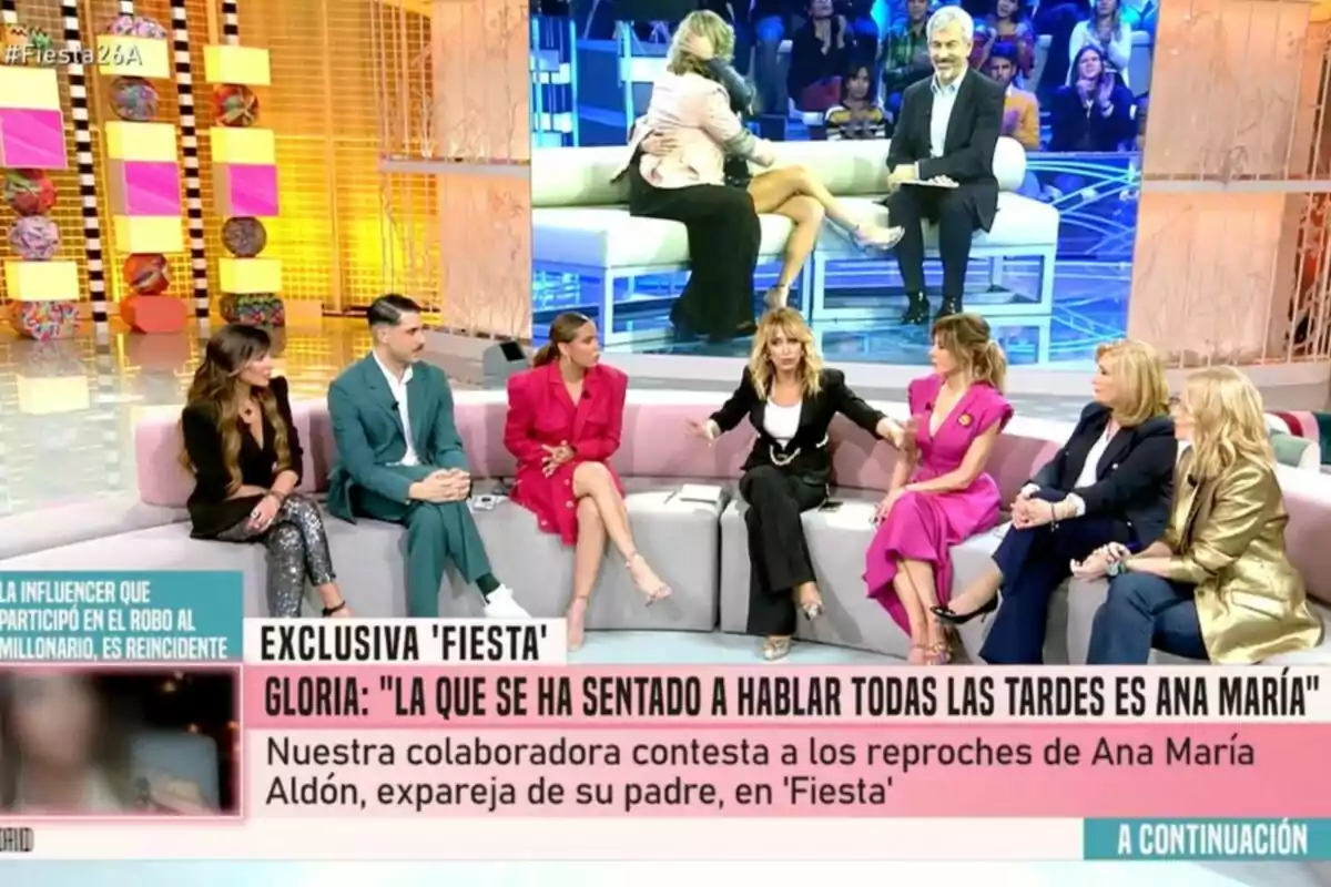 Un grup de persones està assegut en un plató de televisió, participant en un programa d'entrevistes amb una pantalla gran darrere que mostra una imatge relacionada amb el tema discutit. Captura de 'Fiesta'. Un grup de persones està assegut en un plató de televisió, participant en un programa d'entrevistes amb una pantalla gran darrere que mostra una imatge relacionada amb el tema discutit. Captura de 'Fiesta'.