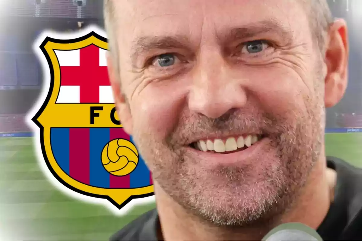 A smiling man with a beard and the FC Barcelona crest in the background.