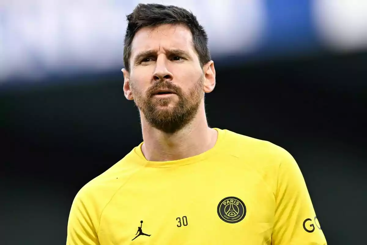 Leo Messi with a yellow Paris Saint-Germain shirt. Leo Messi with a yellow Paris Saint-Germain shirt.