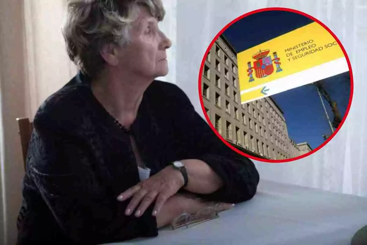 Una dona gran asseguda en una taula, amb una imatge del Ministeri d?Ocupació i Seguretat Social d?Espanya en un cercle vermell superposat.