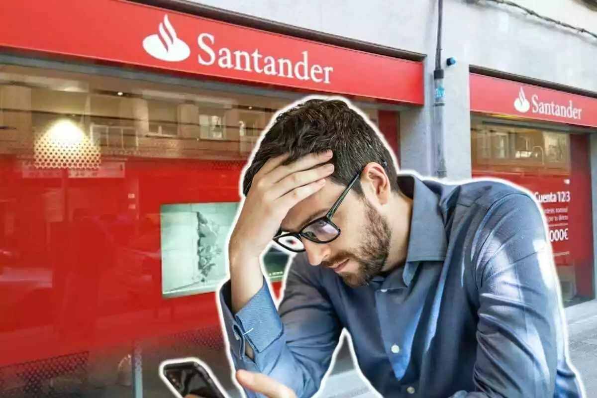 Home amb expressió preocupada davant d'una sucursal del Banco Santander.