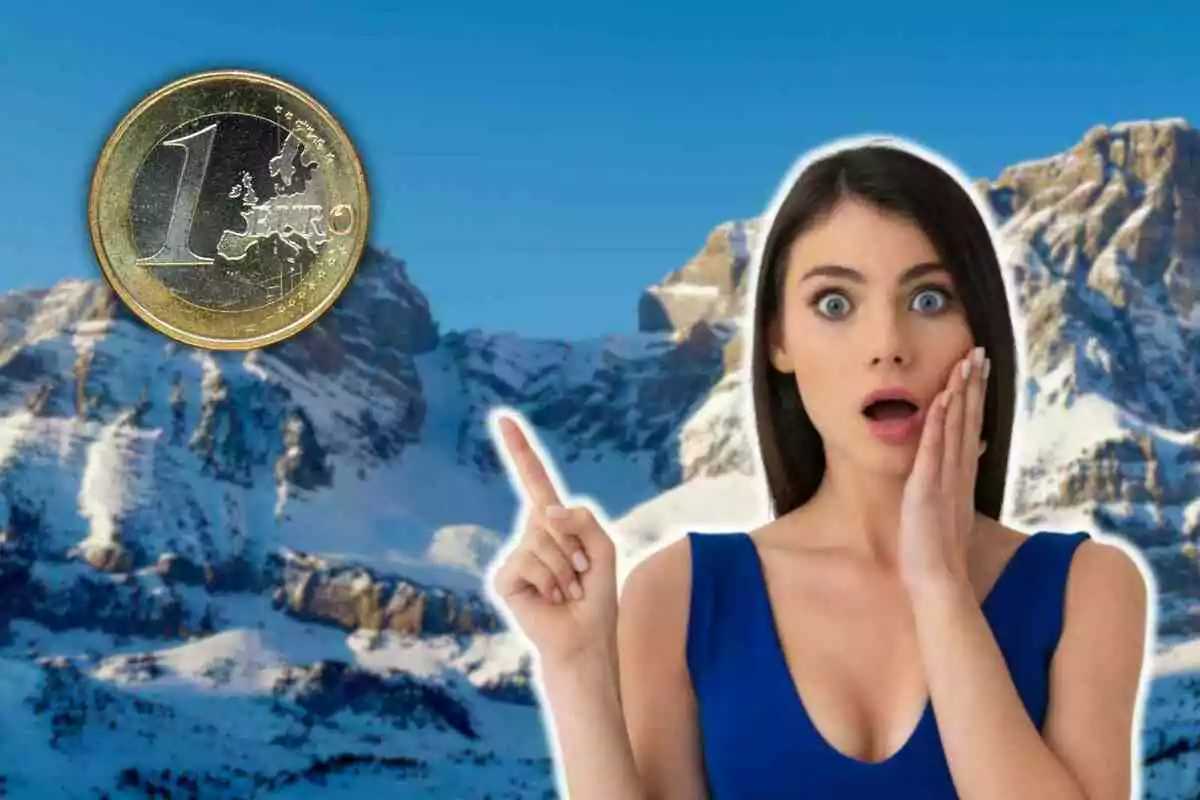 Dona sorpresa assenyalant una moneda d'un euro sobre un fons de muntanyes nevades.