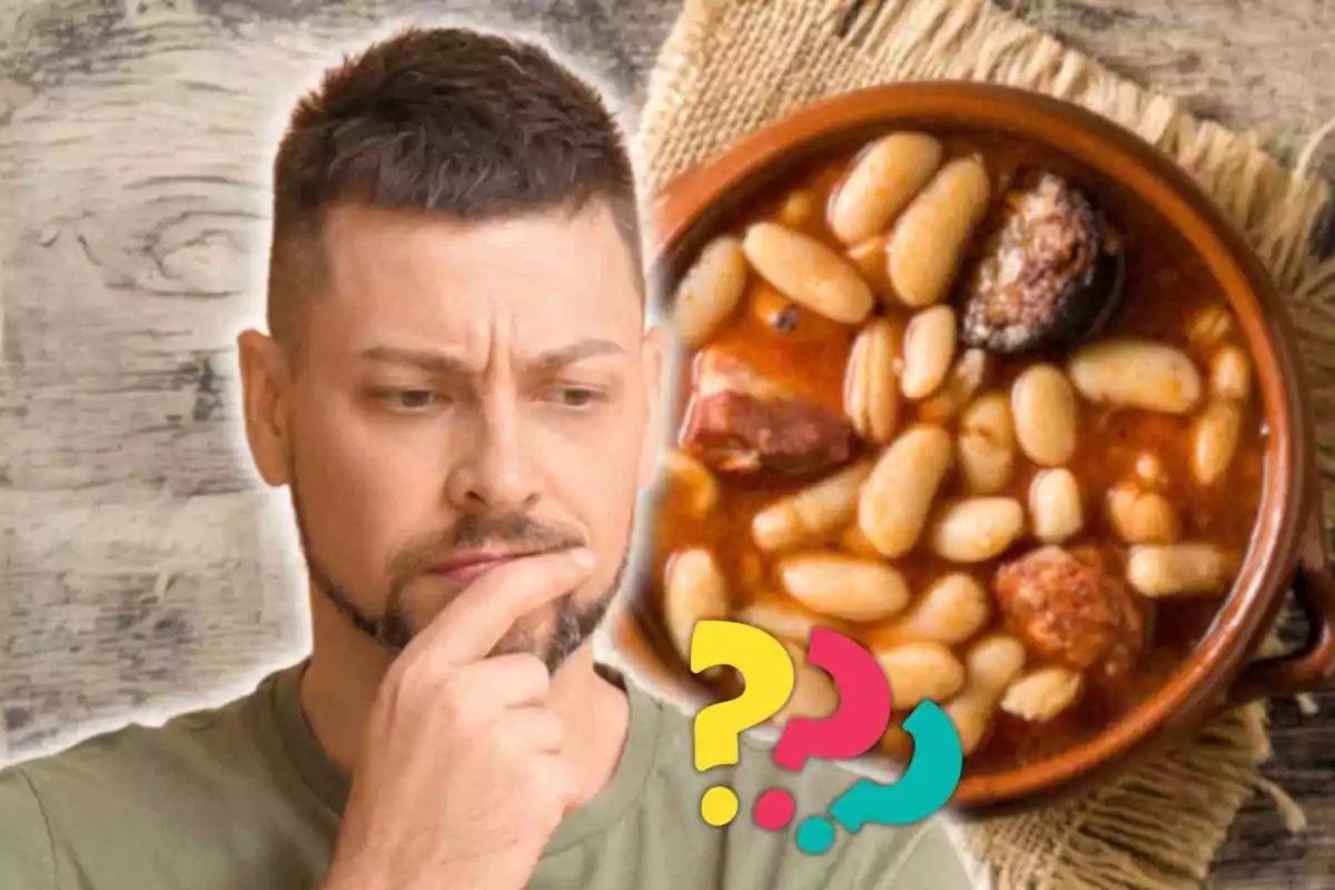 Thoughtful man looking at a plate of beans with chorizo.