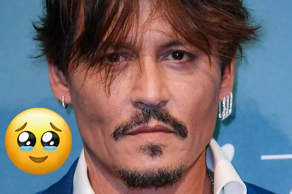 Close-up of a man with a serious expression and an emoji of a face with shiny eyes and a tear on the left cheek