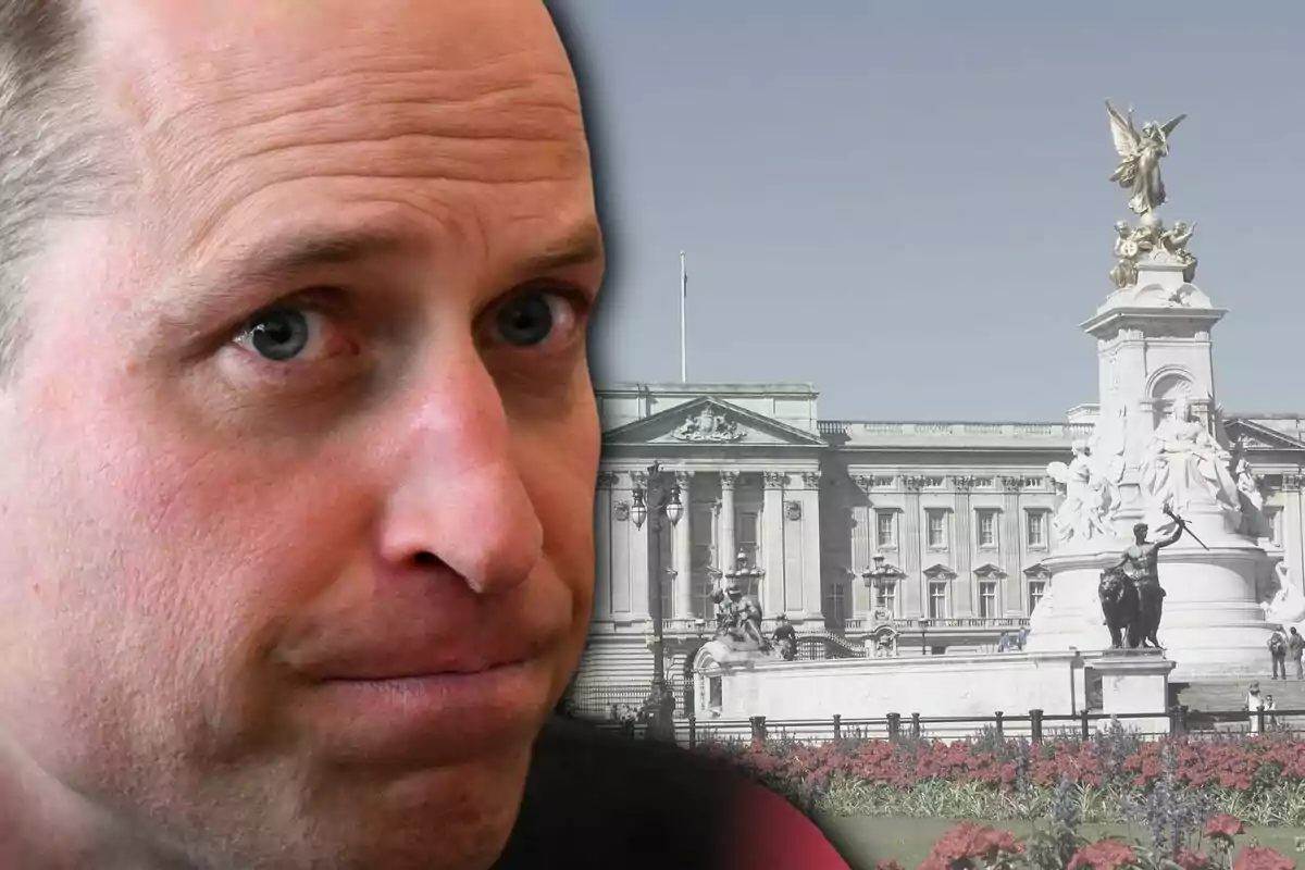 Close-up of a man with a serious expression and, in the background, Buckingham Palace with the Victoria Memorial statue.