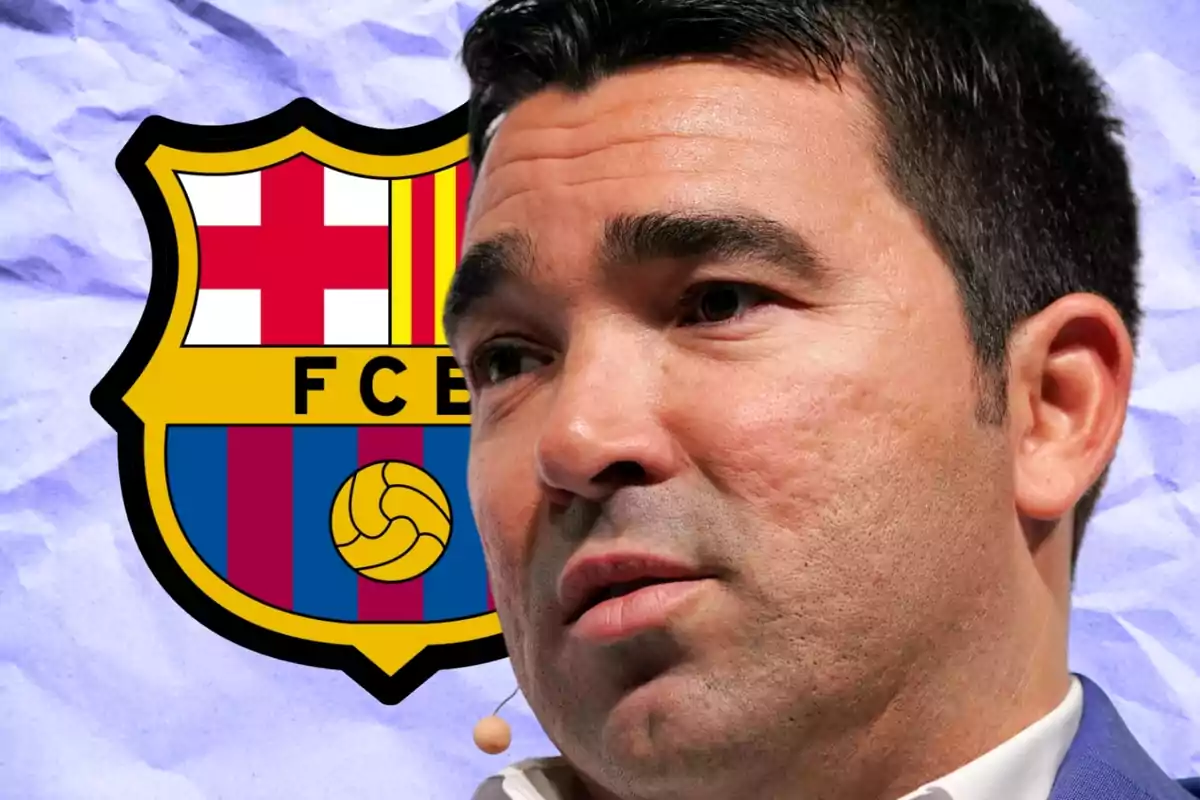 A man with a microphone in his ear in front of an FC Barcelona logo.