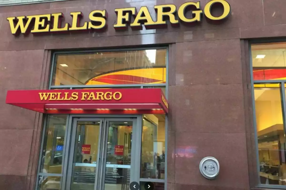 Entrance of a Wells Fargo branch with red and yellow signs. Entrance of a Wells Fargo branch with red and yellow signs.