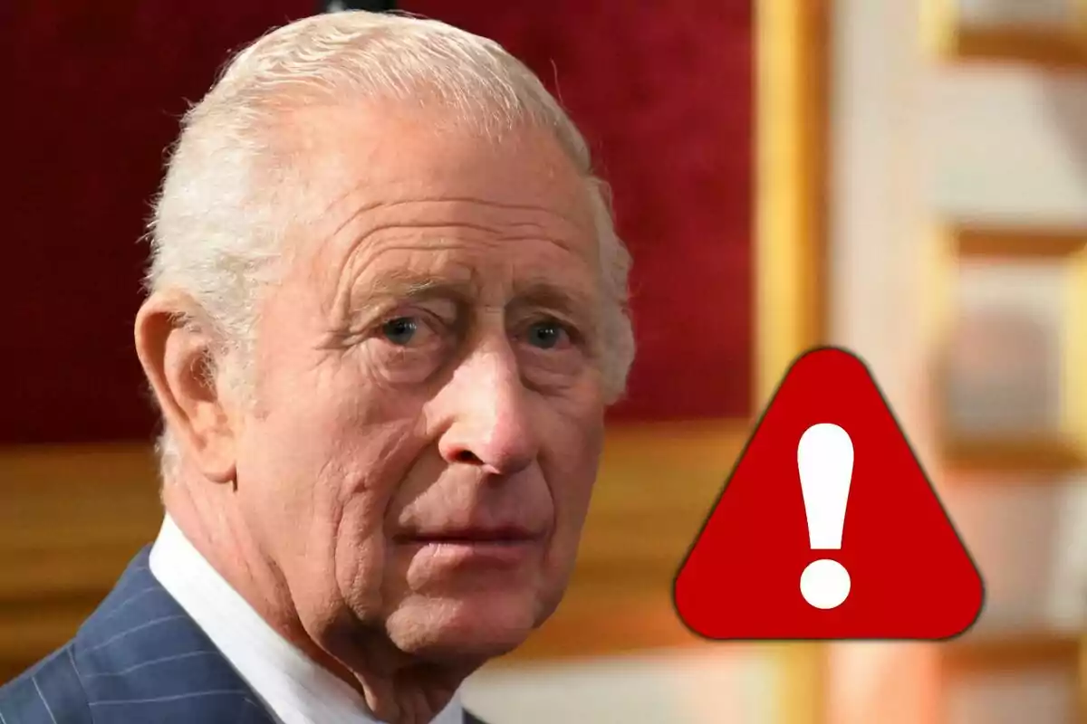 Older man with gray hair and a serious expression, with a red warning symbol featuring an exclamation mark next to him